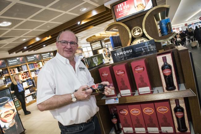 dufry_launches_first_ever_airport_exclusive_single_cask_speyside_single_malt_whisky_-_sandy_mcintyre_tamdhu_distillery_manager_signing_bottles_-_world_duty_free_-_dufry.jpg